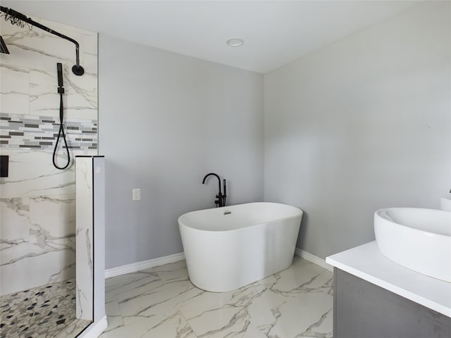 bathroom featuring separate shower and tub and sink