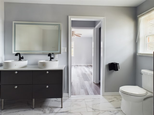 bathroom with vanity, ceiling fan, and toilet