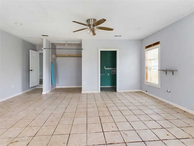 unfurnished bedroom featuring ceiling fan