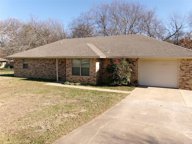 ranch-style home featuring a garage and a front lawn