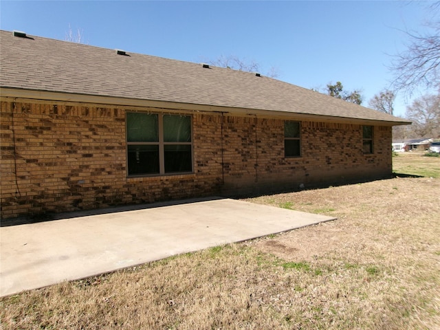 rear view of property featuring a patio