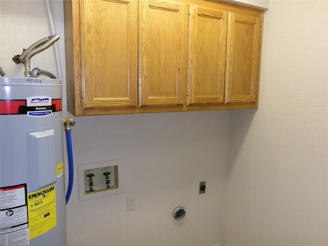 washroom with cabinets, hookup for a washing machine, hookup for an electric dryer, and water heater