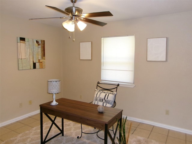 tiled office space featuring ceiling fan