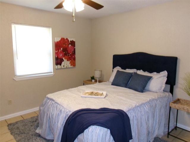 bedroom with light tile patterned floors and ceiling fan