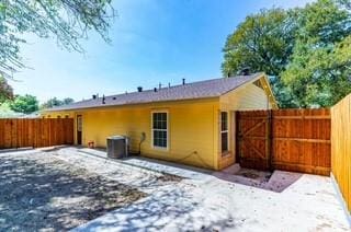 rear view of property featuring central AC and a patio