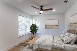 bedroom featuring ceiling fan and hardwood / wood-style flooring