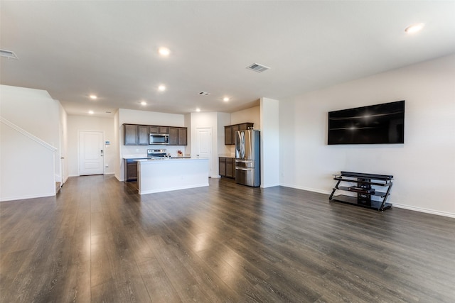 unfurnished living room with dark hardwood / wood-style flooring