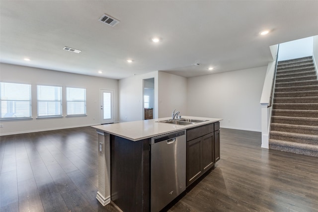 kitchen featuring dishwasher, dark wood-type flooring, sink, an island with sink, and dark brown cabinets