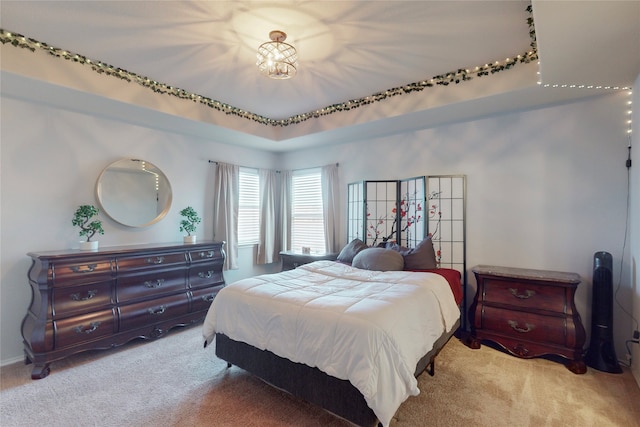 bedroom featuring light colored carpet