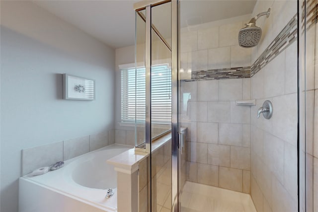 bathroom with separate shower and tub