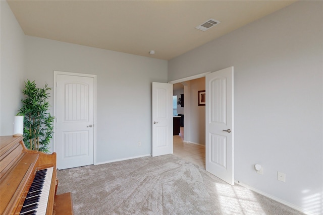 unfurnished bedroom with light carpet