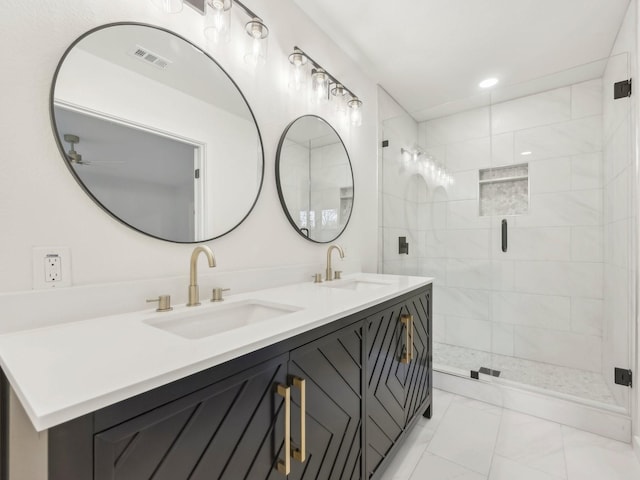 full bathroom featuring double vanity, a stall shower, a sink, and visible vents