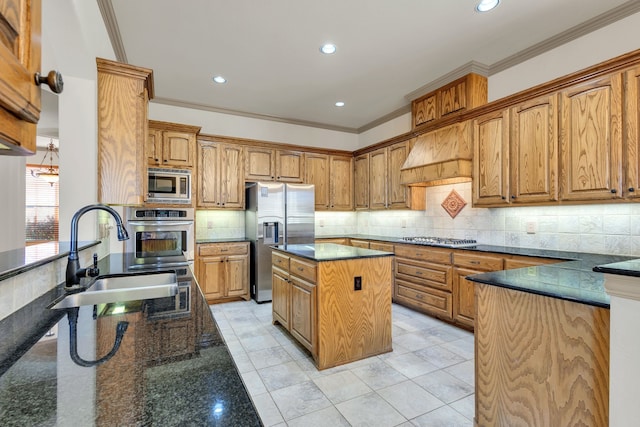 kitchen with sink, a center island, stainless steel appliances, dark stone counters, and ornamental molding