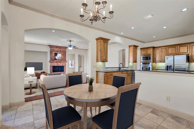 spare room with ceiling fan, wood-type flooring, ornamental molding, and a tray ceiling