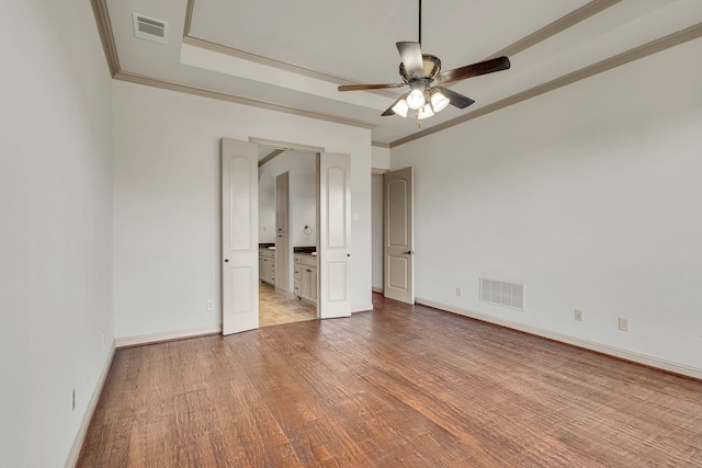 unfurnished bedroom with light hardwood / wood-style flooring, ceiling fan, and ornamental molding