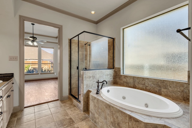 bathroom featuring ceiling fan, tile patterned floors, crown molding, shower with separate bathtub, and vanity