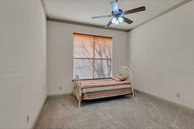 bedroom featuring light carpet, baseboards, a ceiling fan, and crown molding