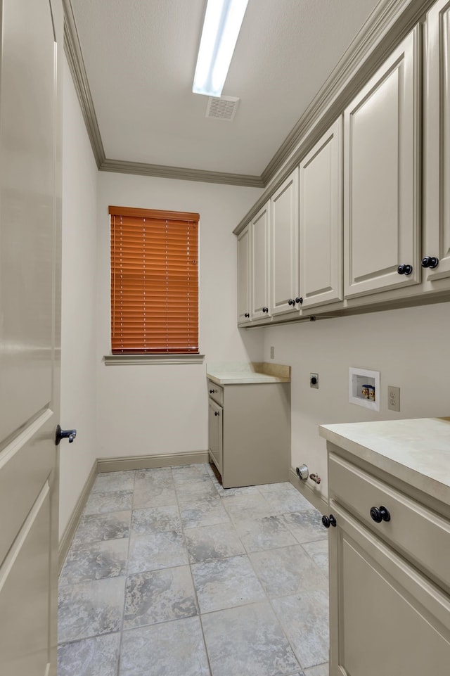 clothes washing area with hookup for an electric dryer, cabinets, ornamental molding, and hookup for a washing machine