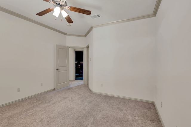 unfurnished room featuring baseboards, visible vents, light colored carpet, ceiling fan, and ornamental molding