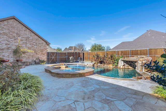 view of swimming pool featuring a fenced backyard, a patio, a fenced in pool, and an in ground hot tub