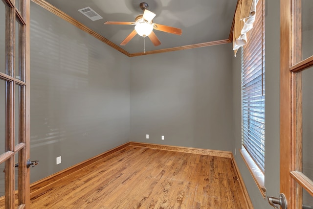 spare room with ceiling fan, light hardwood / wood-style floors, and crown molding