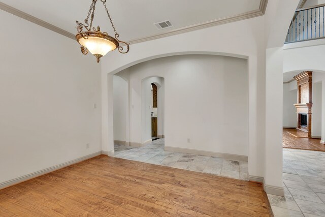 unfurnished room featuring french doors, a wealth of natural light, crown molding, and ceiling fan