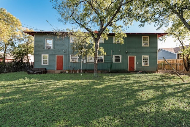 rear view of house with a lawn