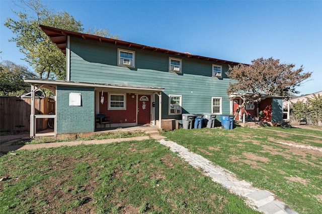 view of front of home with a front lawn