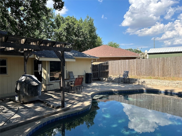 exterior space with area for grilling, fence, a fenced in pool, a pergola, and a patio area