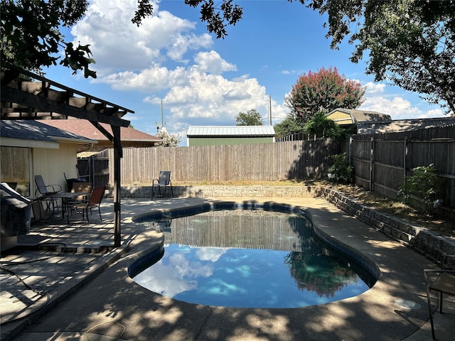 view of pool with a patio area, a fenced backyard, a fenced in pool, and a pergola