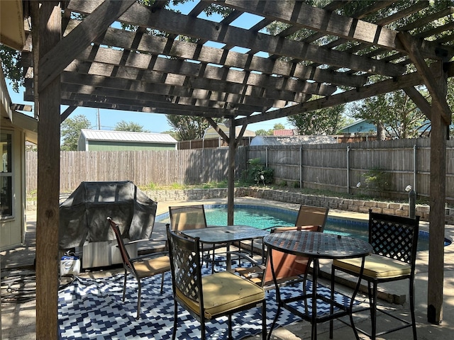 view of patio / terrace with a fenced backyard, a fenced in pool, grilling area, and a pergola