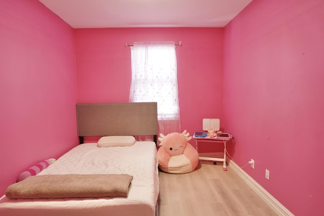 bedroom featuring hardwood / wood-style flooring