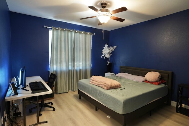 bedroom featuring ceiling fan and wood-type flooring