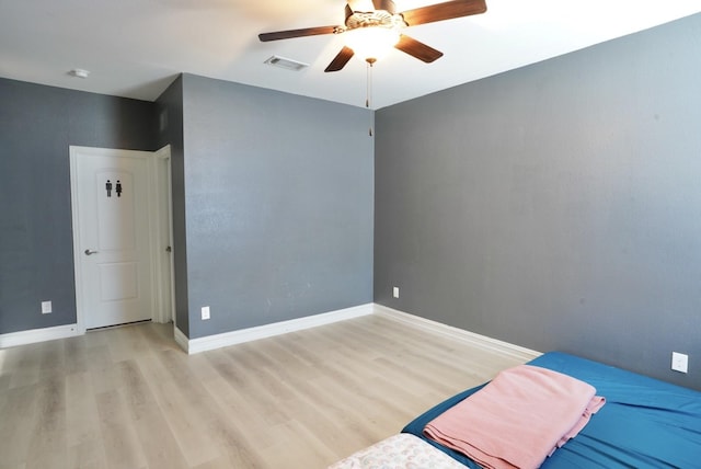 unfurnished bedroom featuring light hardwood / wood-style floors and ceiling fan