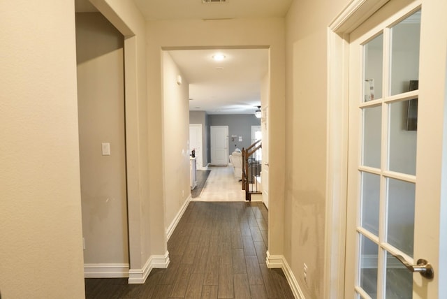 hallway featuring dark wood-type flooring