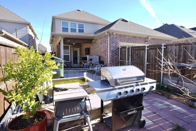 back of house with a patio