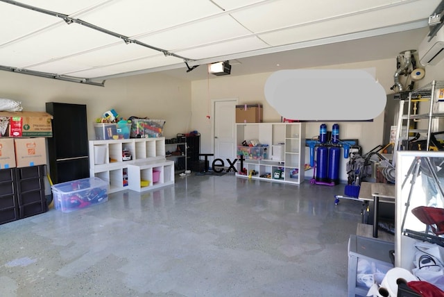 garage featuring a garage door opener and an AC wall unit