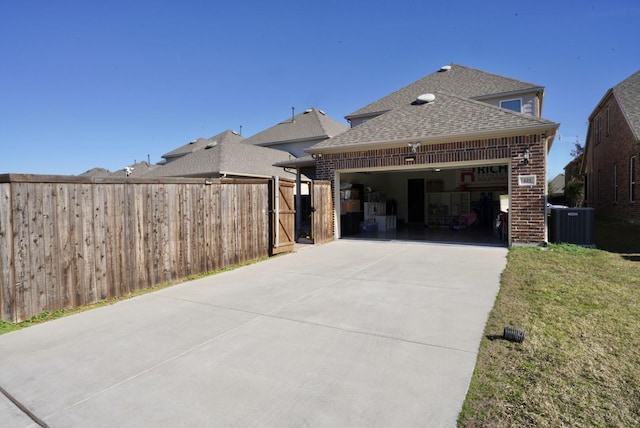 exterior space featuring a garage and a front lawn