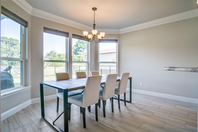 dining area with a notable chandelier and ornamental molding