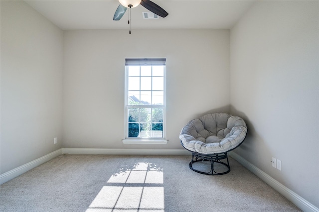 unfurnished room featuring light colored carpet and ceiling fan