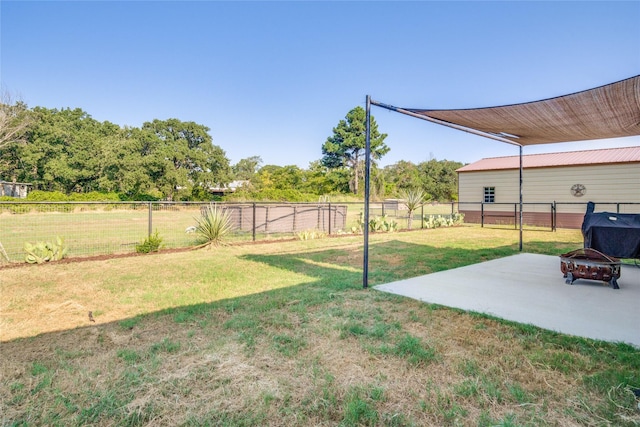 view of yard with a fire pit and a patio area