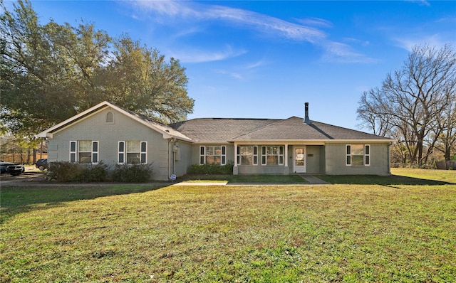 single story home with a front yard