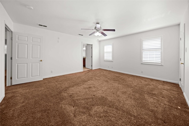 carpeted empty room with ceiling fan