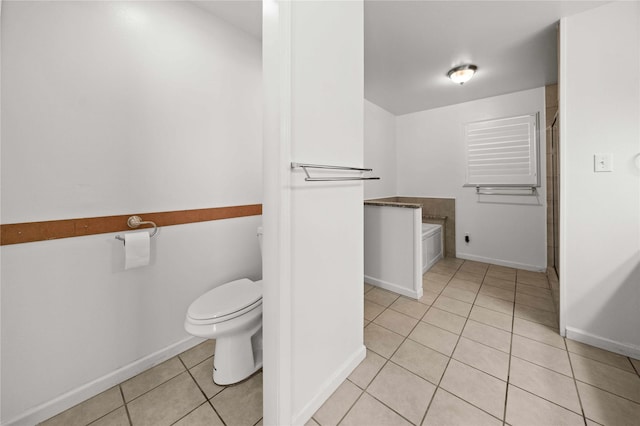 bathroom featuring tile patterned floors and toilet