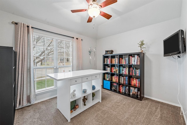 interior space with ceiling fan and light carpet