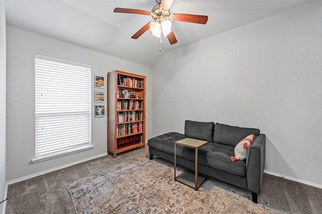 sitting room featuring a wealth of natural light, carpet floors, and vaulted ceiling