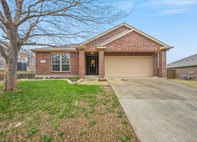 ranch-style house with a garage, central AC unit, and a front lawn