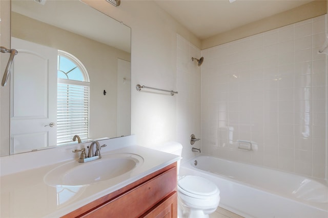 full bathroom featuring vanity,  shower combination, and toilet