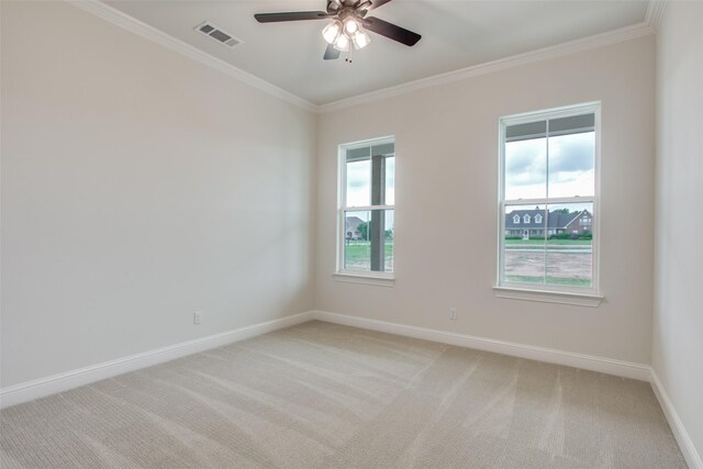 empty room with light carpet, ceiling fan, and ornamental molding