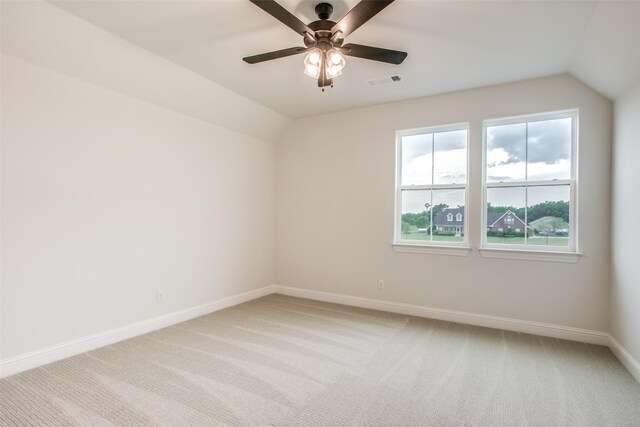 additional living space featuring ceiling fan, light colored carpet, and lofted ceiling